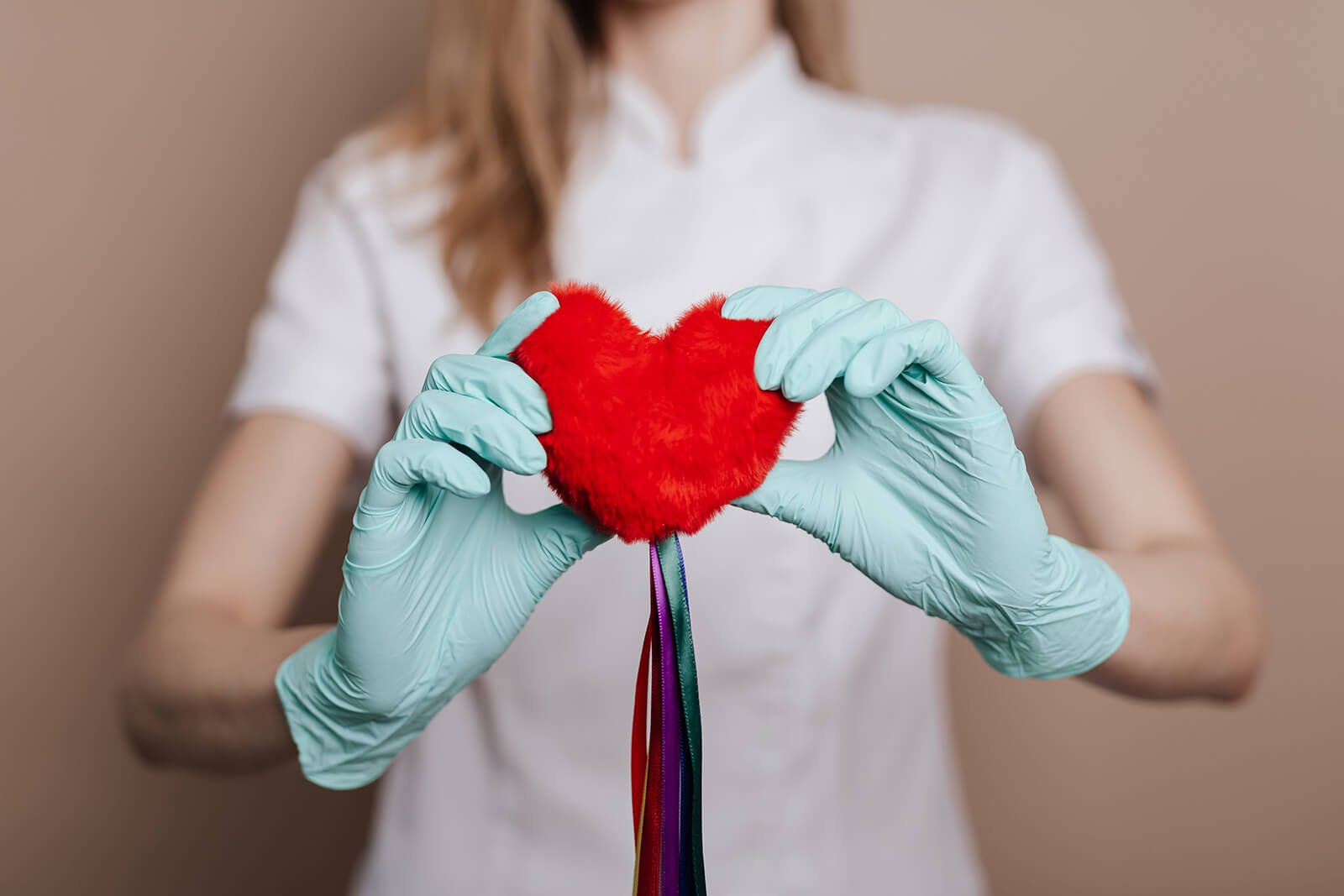 Woman Holding Red Heart with Strings